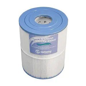 A cylindrical pool or spa filter cartridge with a blue top and bottom, white pleated sides, and a label reading Replacement Filter Cartridge and HotSpring on the front.