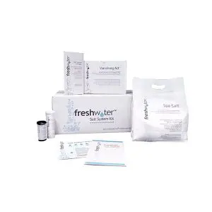 FreshWater Salt System Kit includes a large box, a bag of spa salt, test strips, instruction booklets, and a Vanishing Act box, all arranged on a white background.