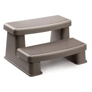 A two-step, sturdy, brown plastic step stool with textured surfaces on each step, designed for easy access to higher areas such as beds or hot tubs.